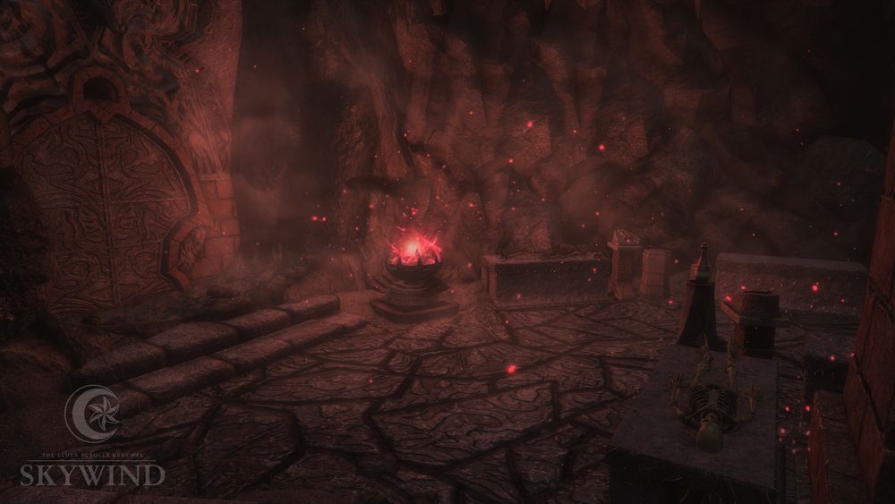 Picture from inside Ibar-Dad, showing an area of the cave with an ornate stone door and intricate stone floor patterns. Two skeletons lay on stone tables, and a magical brazier fills the room with embers and a red glow.