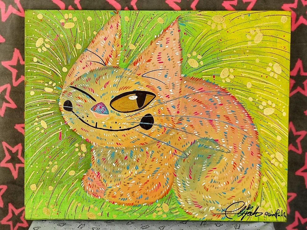 Acryllic painting of s very colourful cat in magenta, blue, orange, creame and white in a green and yellow background with colourful sprinkles and metallic and gold lines. There's also some gold pawprints on the background.