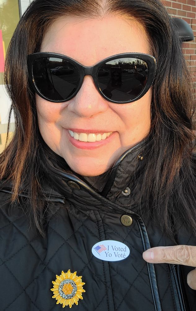 Me wearing an I voted sticker