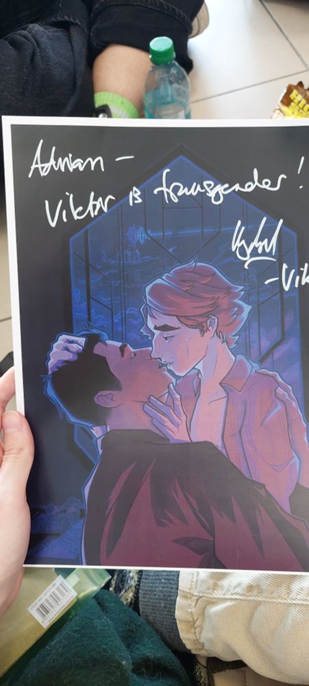 my jayvik art print signed by harry lloyd. it says "Adrian, Viktor is transgender! Harry - Viktor"