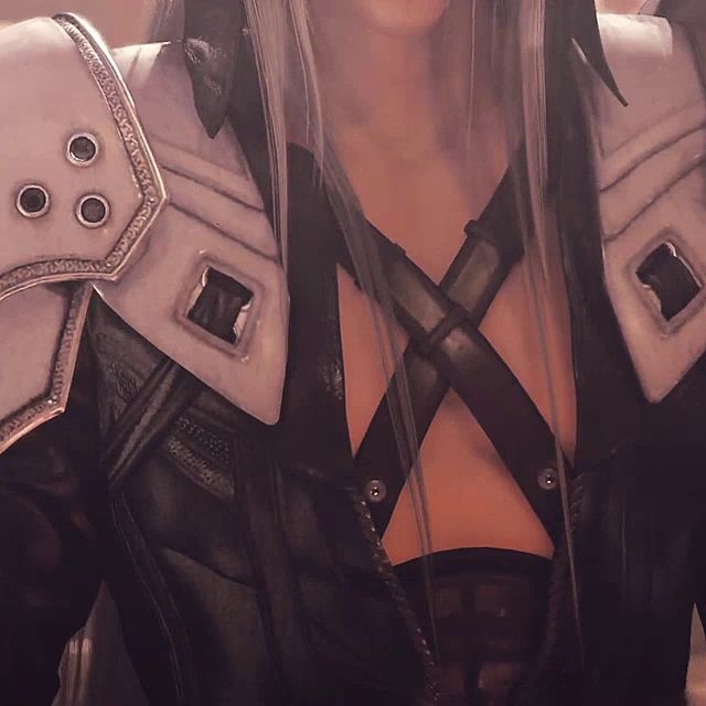 a close up of a person 's chest and shoulder pads with holes in them