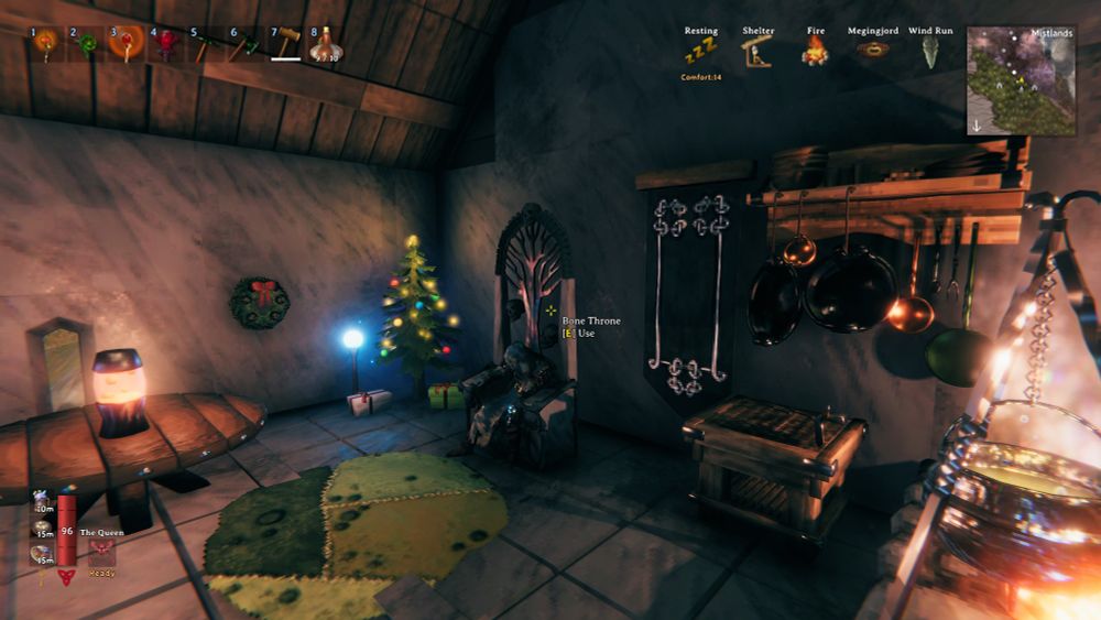 Valheim spellcaster sitting in a chair near a warm fire