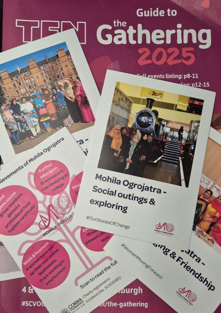 Burgundy-coloured brochure for The Gathering with four postcards on top. These have pictures and text about a group called Mohila Ogrojatra and the logo of Corra Foundation