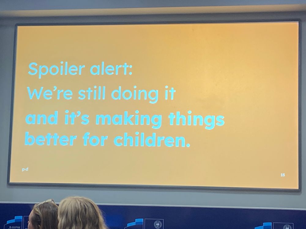 A slide from a presentation: “Spoiler alert: We’re still doing it and it’s making things better for children”
