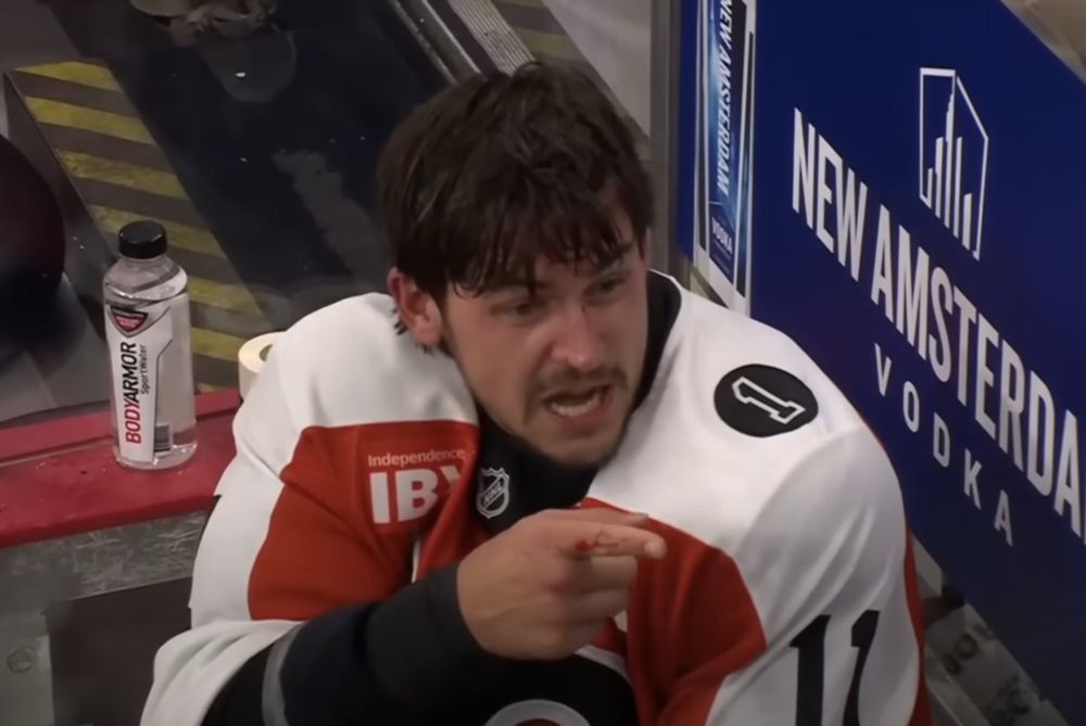 TK in the penalty box pointing his finger 