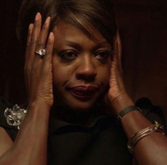 viola davis with her hands over her ears looking done with everything 