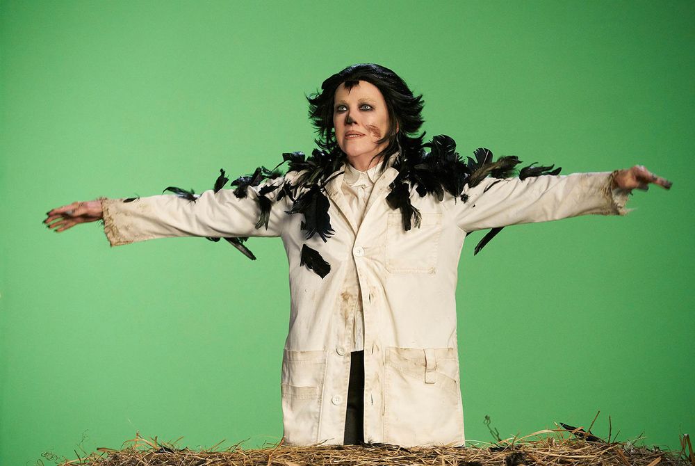 Moira Rose from Schitts Creek dressed in her outfit from "The Crows Have Eyes 3: the Crowening". Kaw Kaw! 