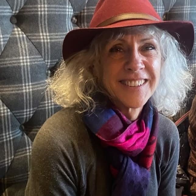 Michelle Schuman with a hat and scarf. Author, wildlife biologist, wetland scientist, and Alaskan ecologist.