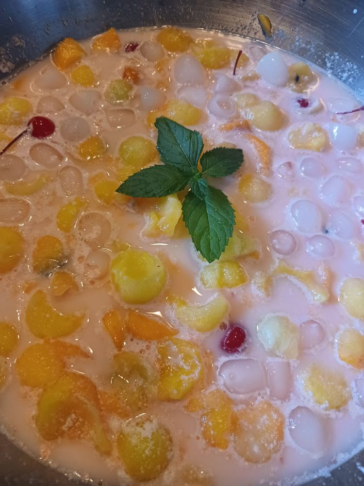 Fruit, milk, and clear soda create a pink Hwachae, a Korean summertime dessert. 