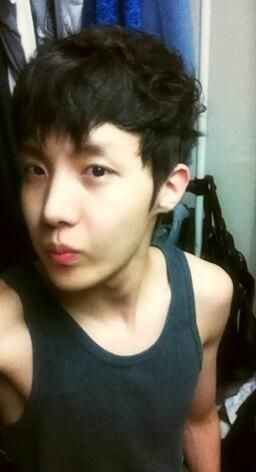 BTS rapper, j-hope in the very early days of BTS, 13 days after debut. He wears a grey tank top.
