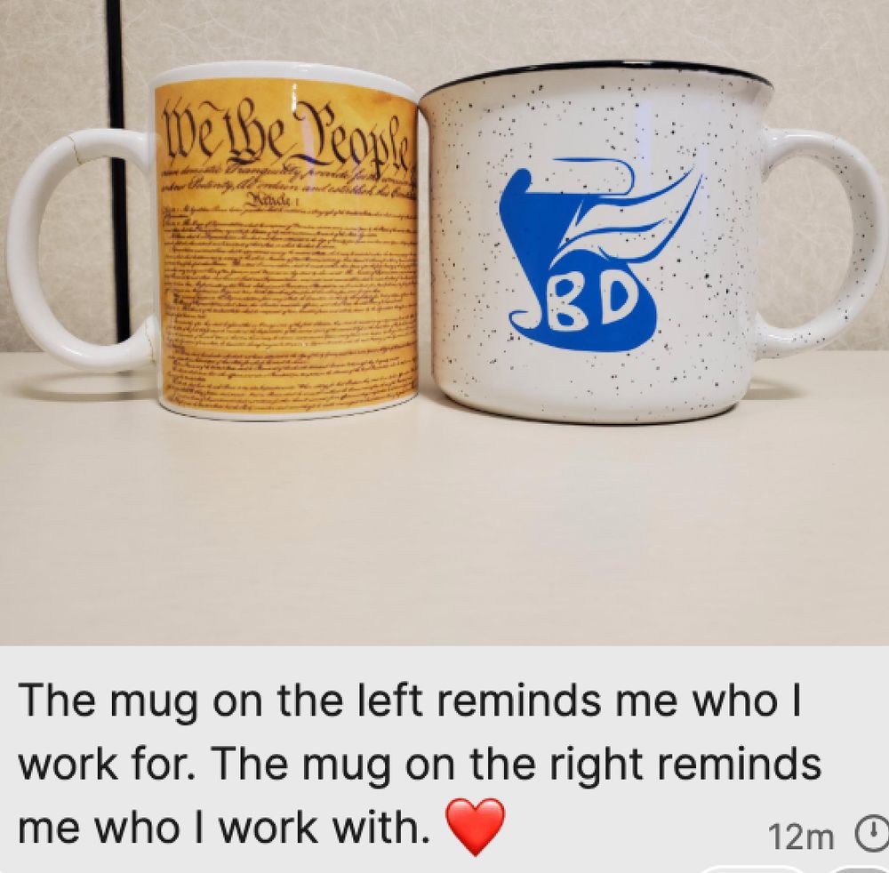 Two mugs, one with the Constitution and one with a logo for the Bethesda Declaration, a letter written by NIH staff about actions misaligned with the NIH mission.