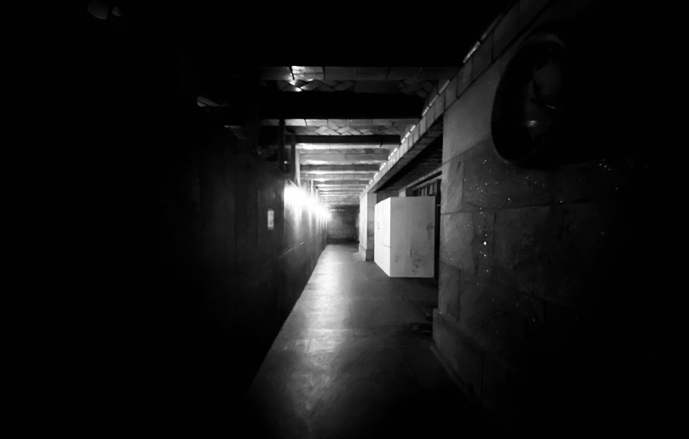 Dark photo of a hallway in Grand Central Station.