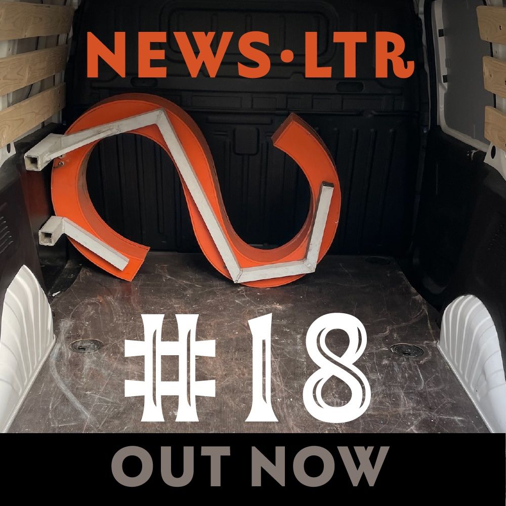 Red capital letter S in the back of a white van. Text reads "NEWSLTR #18 OUT NOW". 