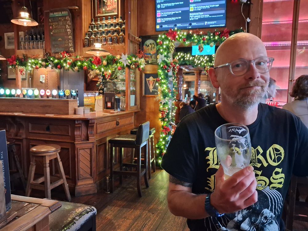 A big bady eejit with a mostly drunk pint, in the pub for an anniversary lunch.