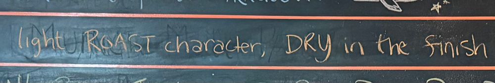 “Light Roast character, dry in the finish” written in chalk 