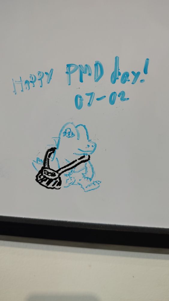 A simple doodle of a totodile sitting down with a treasure bag, captioned "Happy PMD day! 07-02"