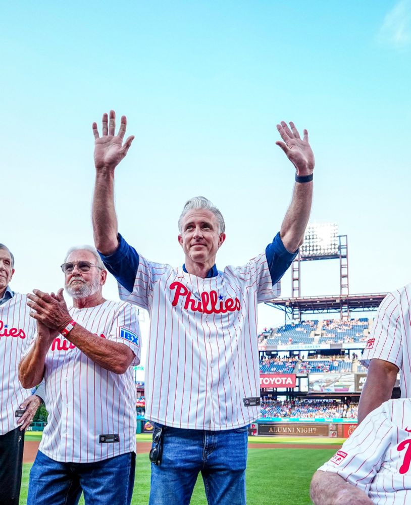 Chase Utley waves to the crowd as he's introduced during pregame ceremonies.