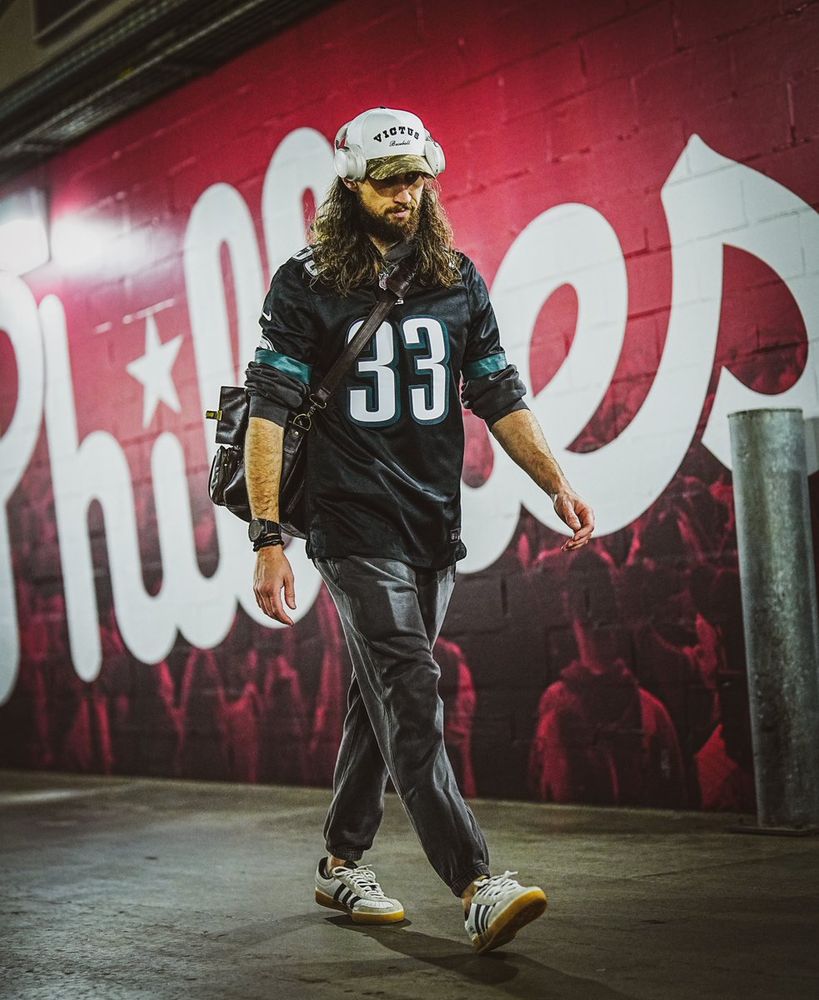 Matt Strahm is pictured wearing a no. 33 Eagles jersey