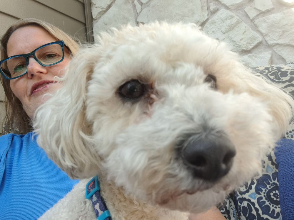 Pepper, with Miranda hiding behind the dog