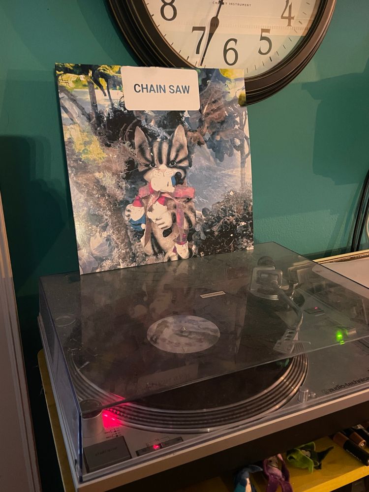 Vinyl record called “Chain Saw” from the band, WyWolf