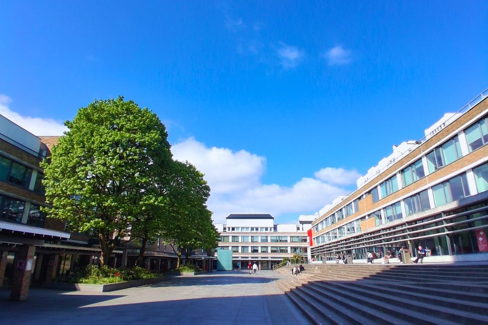 A blue sky over Alexandra Square on campus.