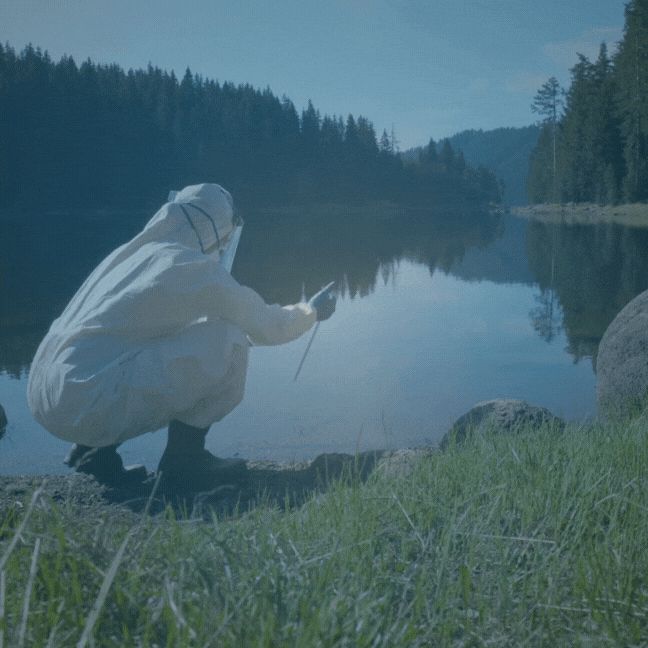 Gif of a scientist taking a water sample from a lake surrounded by trees. Text overlay reads "We needs scientists' voices more than ever. Help us help them" with the CSLDF logo.