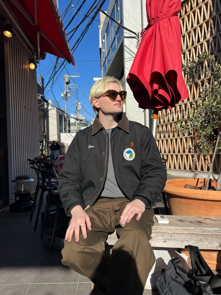 Nic sitting waiting handsomely for pizza 