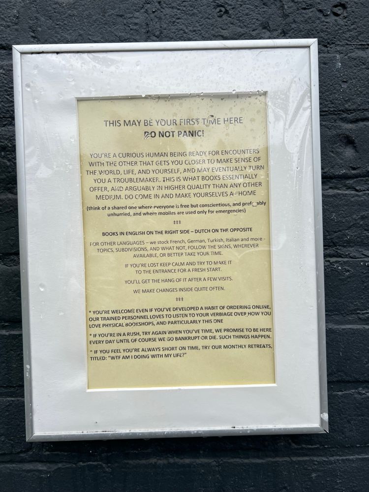 “Autobiography” of a bookstore in Amsterdam called Le Flaneur posted outside the entrance 