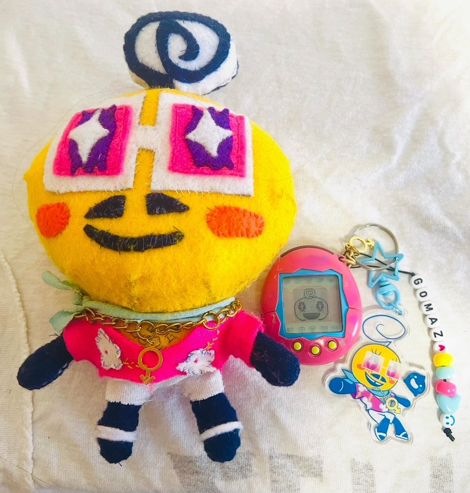 Original memetchi Gomaz in plush, toy, and keychain form
