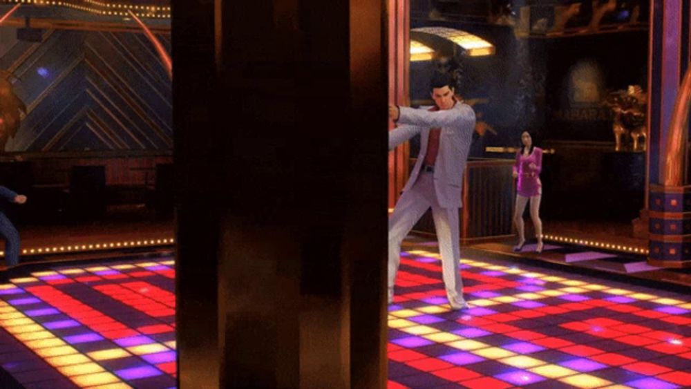 a man in a suit is dancing on a dance floor in a video game