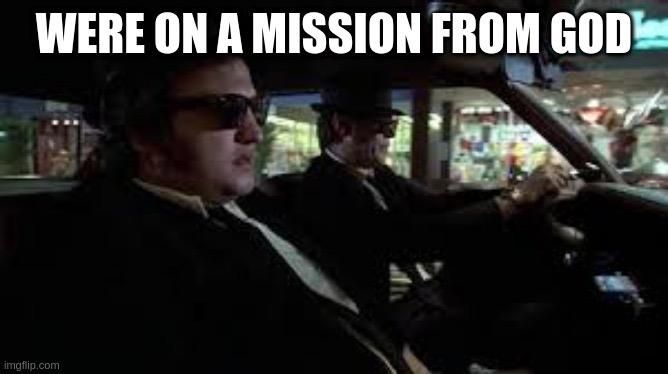 Screencap from the movie: Blues Brothers in their cop car. WERE ON A MISSION FROM GOD 
