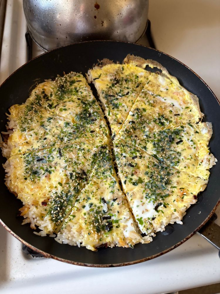 Egg and rice pancake cut into wedges 