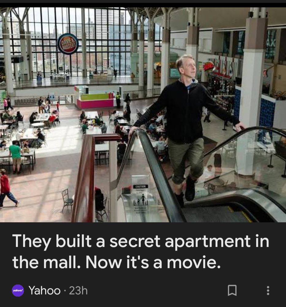 A man is seen going up an escalator of an indoor mall.

Below the picture are the words "They built a secret apartment in the mall. Now it's a movie." 
Credit Yahoo