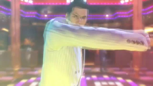 a man in a white suit is dancing in a disco