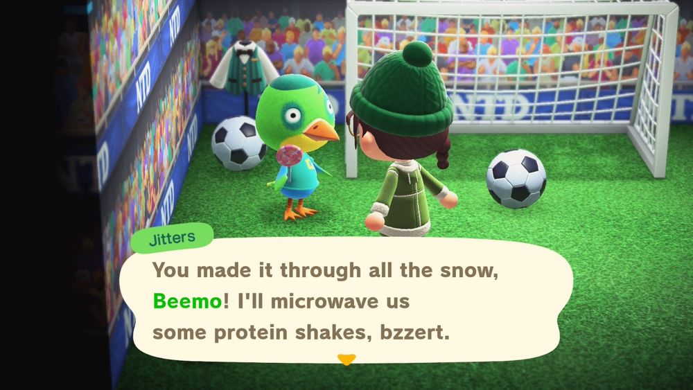 Jitters: "You made it through all the snow, Beemo! I'll microwave us some protein shakes, bzzert."

My character, wearing a green winter coat and green winter hat, is standing in front of Jitters in his house. His house is a soccer field with soccer goal, two soccer balls, crowd cheering wallpaper, and he has a shirt with vest on display. Jitters is holding a lollipop.