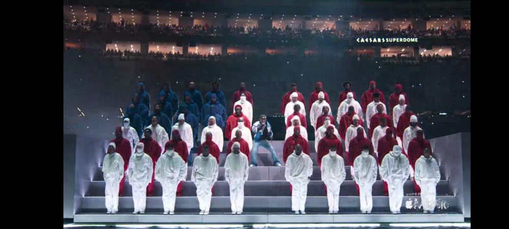 Kendrick Lamar performing the half time show at the Superbowl February 9, 2025. Superbowl LIX . His dancers are in red, white, blue standing in formation as the USA flag.