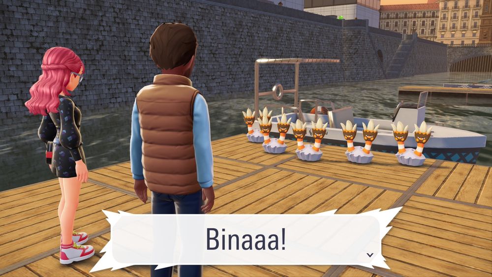 My character, a quest giver, and five Binacle Pokemon on a dock in front of a boat in a canal. The 5 Binacle are screaming "Binaaa!".
Pokémon Legends Z-A

The Binacle are barnacle pokemon with two heads sticking out of a rock. 

My character has pink hair, glasses, and is wearing a black romper and white/red sneakers. The quest giver is wearing a brown puffer vest over a blue long sleeve shirt and jeans. 