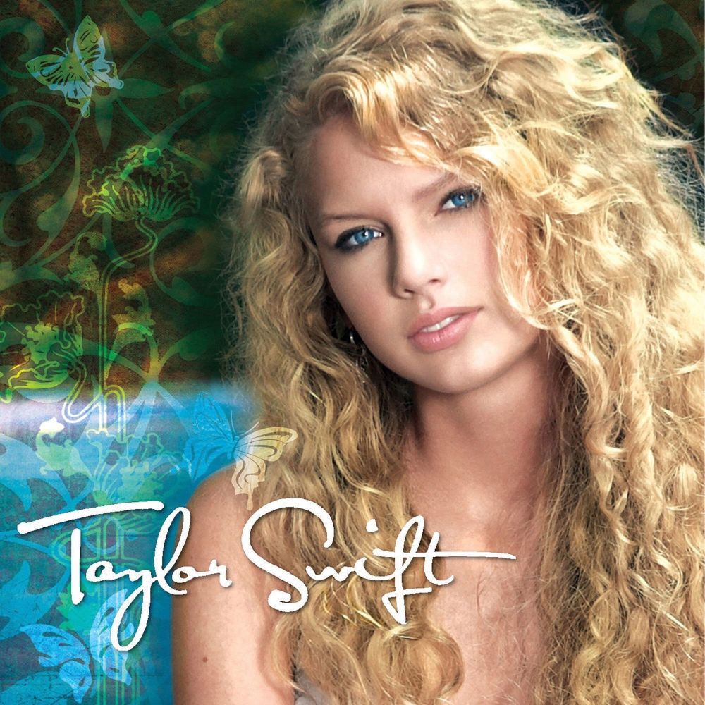 Taylor Swift debut album cover.

a young Taylor Swift with curly hair against a blue and green background with green butterflies, "Taylor Swift" is written in white cursive.