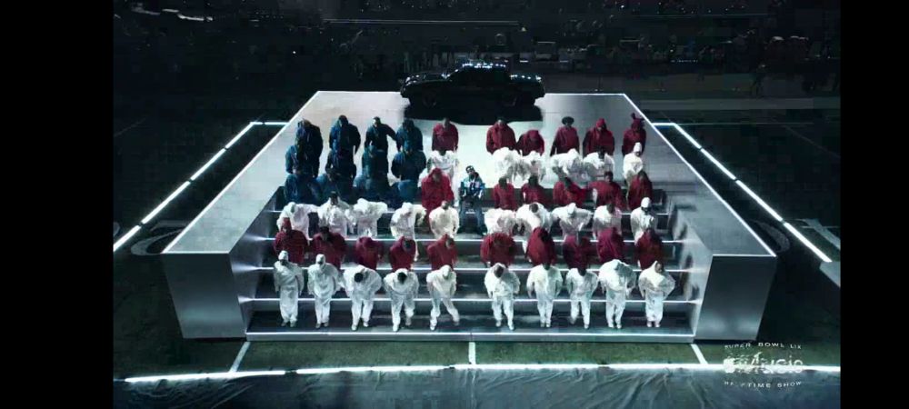 Kendrick Lamar performing the half time show at the Superbowl February 9, 2025. Superbowl LIX . His dancers are in red, white, and blue forming the flag.