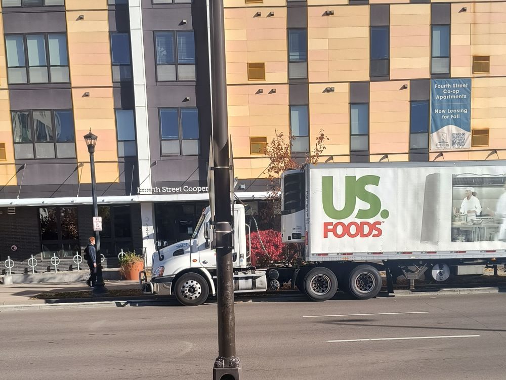 Semi parked in a curbed bike lane