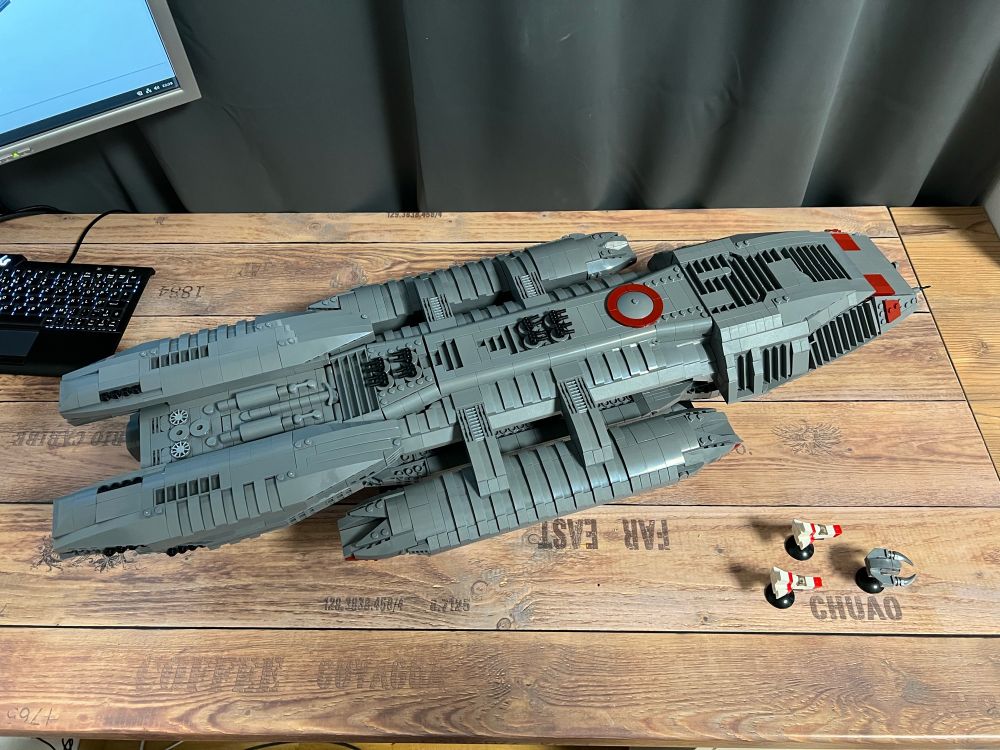 Brick build Battlestar Galactica 80cm long, made by BlueBrixx from 3700 bricks. Accompanied by two tiny Viper Mark 2 and a Cylon Raider - top view
