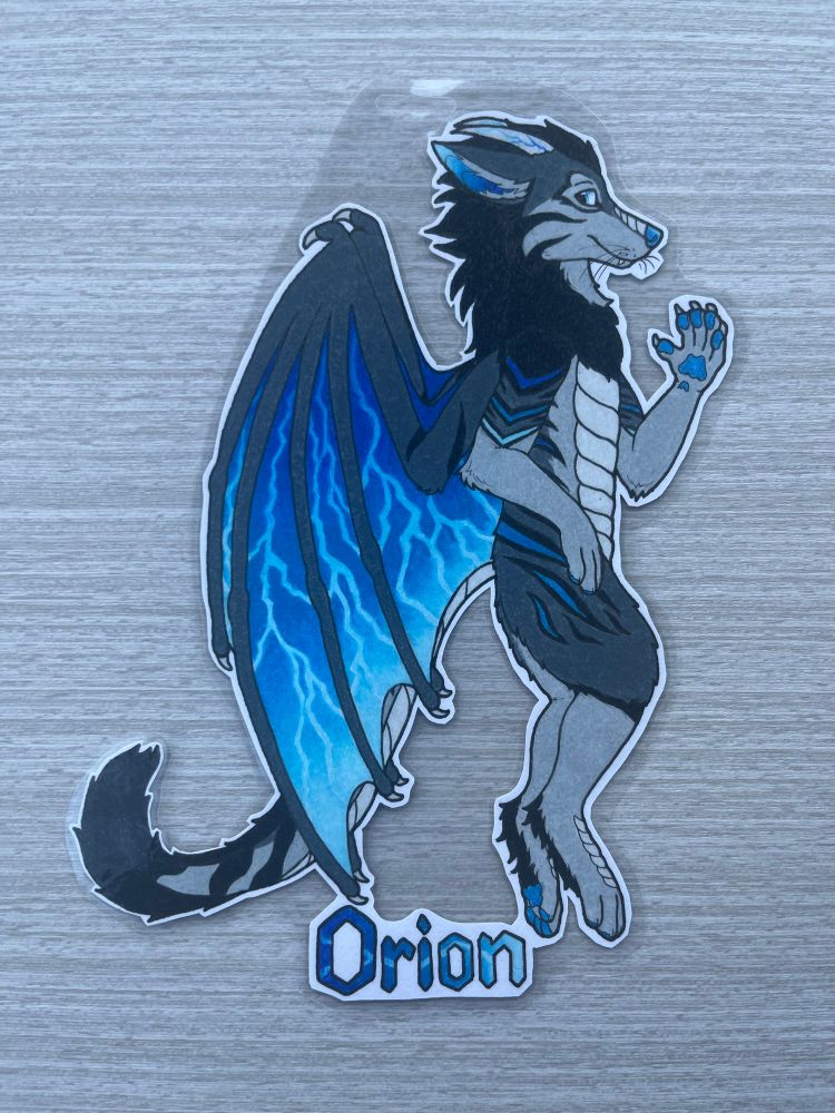 Traditional badge of a gray and blue striped anthro wolf/dragon/tiger hybrid OC named Orion. He has blue and gray wings.
