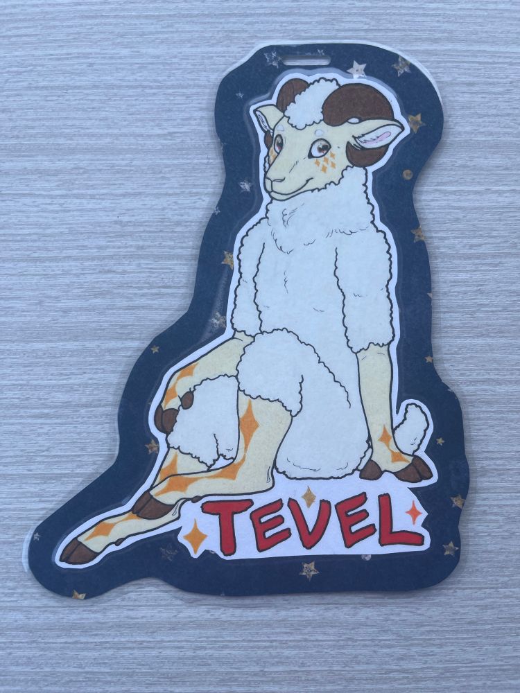 Traditional badge of a white, orange, and brown anthro sheep OC named Tevel.