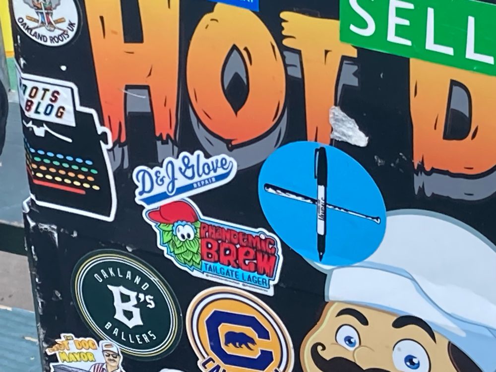 Closeup on the stickers on Mike Davie's hot dog rig