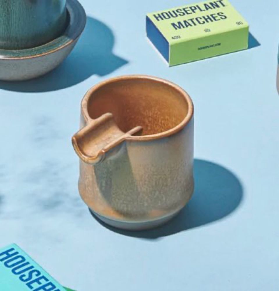 photo of a unique, round ceramic ashtray with a joint tray, made by the Houseplant company. 