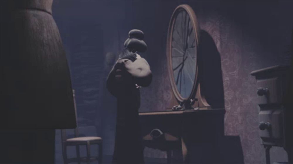 a dark room with a clock in the background