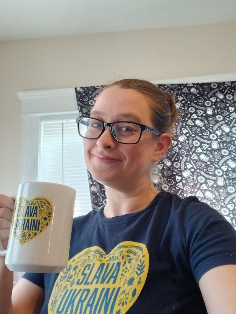Me wearing my Slava Ukraini shirt and holding my Slava Ukraini mug