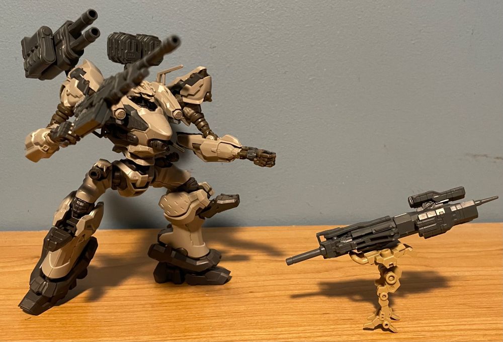 Bandai 30MM AC6 Nightfall model chasing after a small drone that has stolen its pilebunker