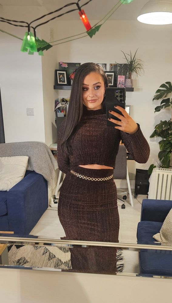 Brown sparkly top and skirt. Gold Belt.