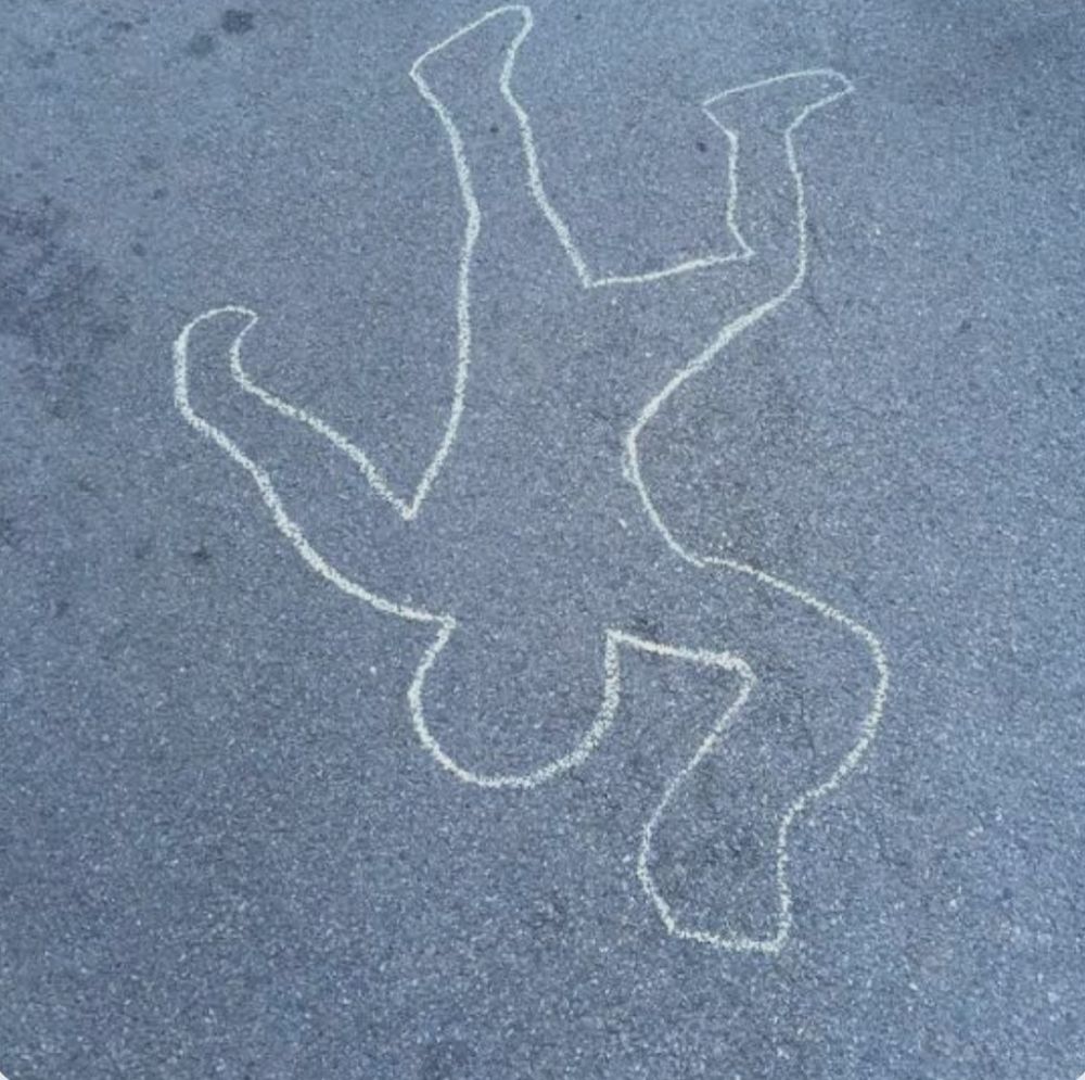 A chalk outline is used to demonstrate that people were killed in Hiroshima on this day, August 8